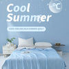 A light blue silk summer quilt is displayed on a bed, with ice cube graphics and cool summer text in the background.
