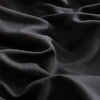 A close-up of a dark gray soft washed duvet cover fabric with visible folds and texture.