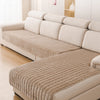 A beige L-shaped corner flannel sofa cover with light cream upholstery and quilted texture.