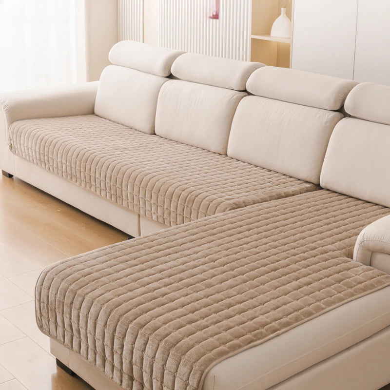 A beige L-shaped corner flannel sofa cover with light cream upholstery and quilted texture.