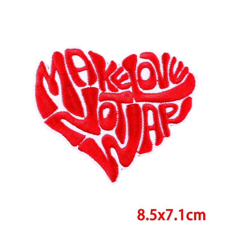 Red heart shape embroidered patch with the text Make Love Jot Jar
