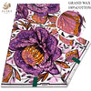 A bolt of purple and orange African wax print fabric with floral patterns.