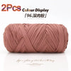 A skein of pink reusable elastic yarn is shown rolled up for crafting.