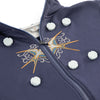 A dark blue magnetic embroidery hoop set with a zipper and decorative stitching on the fabric.
