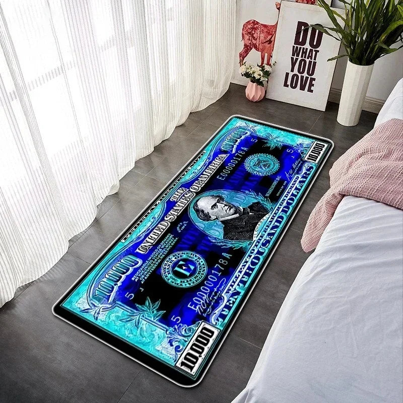 A rectangular blue and black decorative floor mat featuring a portrait and currency symbols placed on a white bed.
