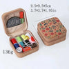 A brown fabric storage box containing various sewing needles and tools.