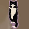 A decorative mat featuring a black cat silhouette on a light background with purple edging.