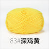 A ball of bright yellow organic cotton 4ply knitting yarn.