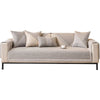 A beige woven sofa cushion cover with light gray accent pillows on a modern sofa.