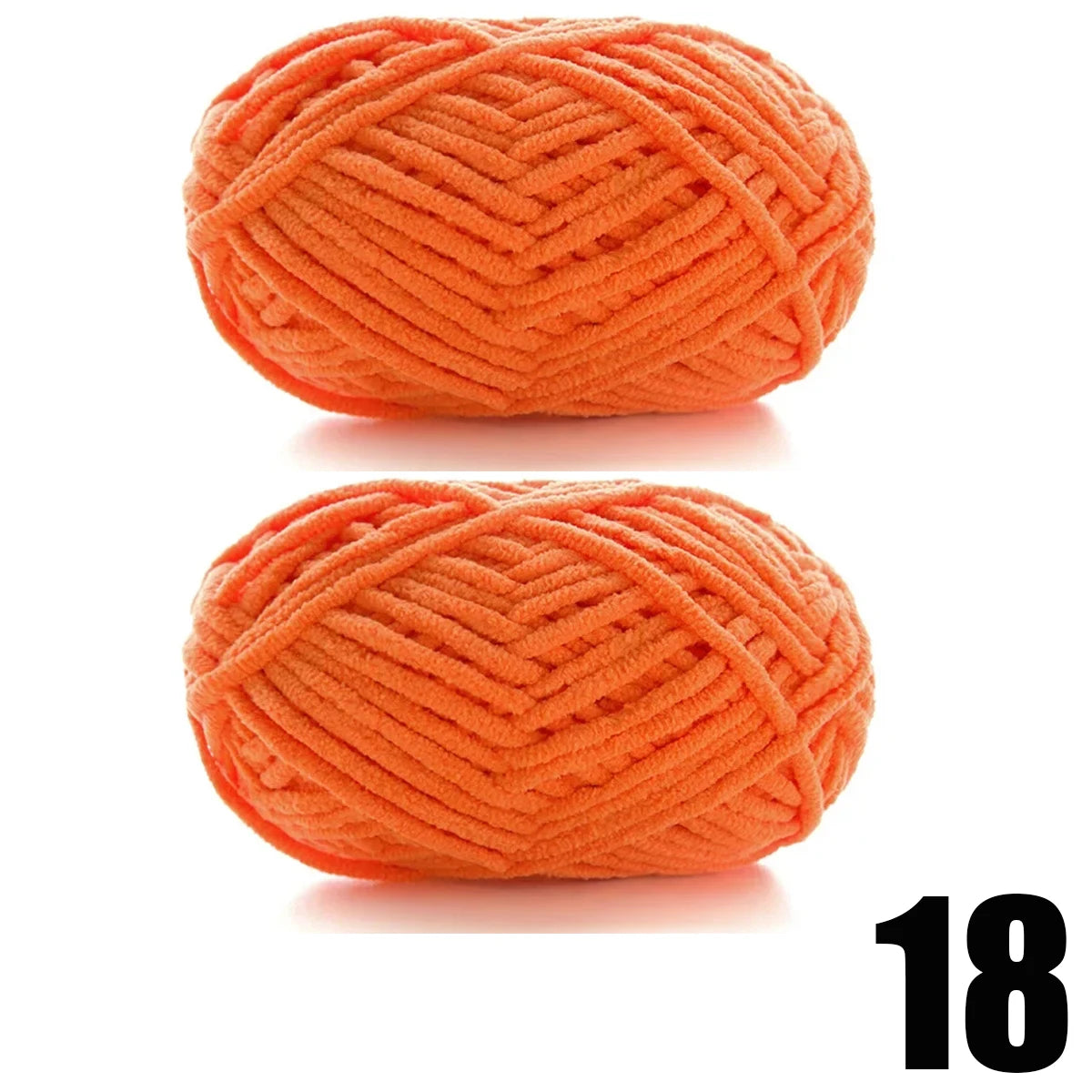 A ball of bright orange thick velvet yarn with a textured, woven pattern.