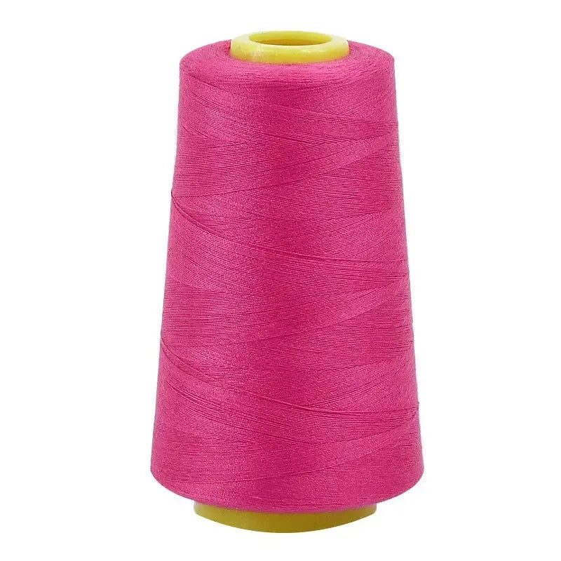A magenta sewing thread spool with a yellow core.