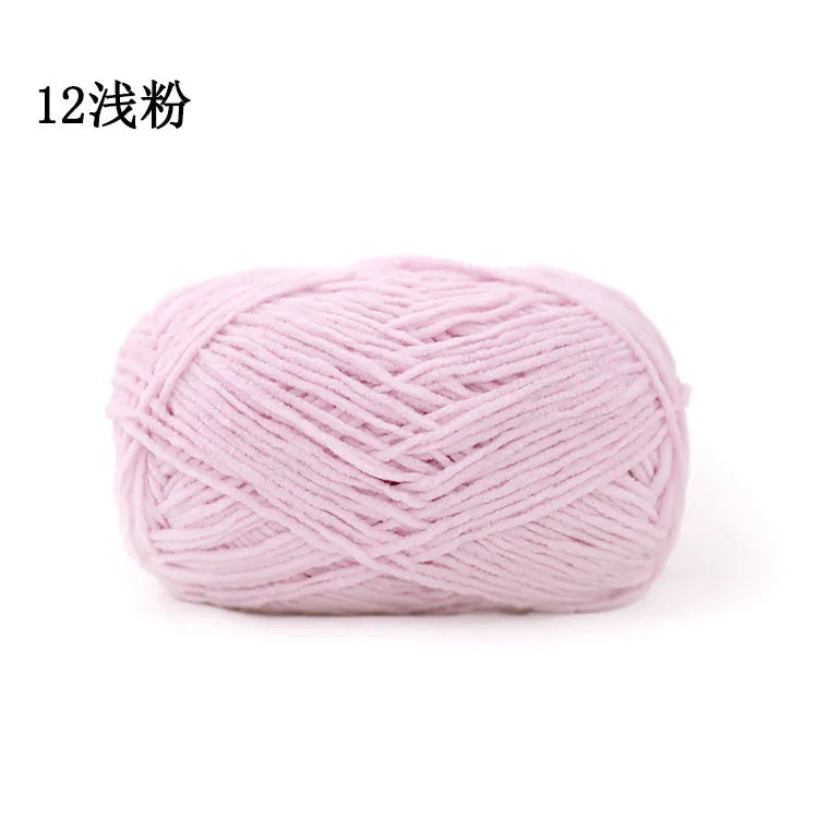 A ball of light pink 3mm matte chenille yarn for knitting and crochet.