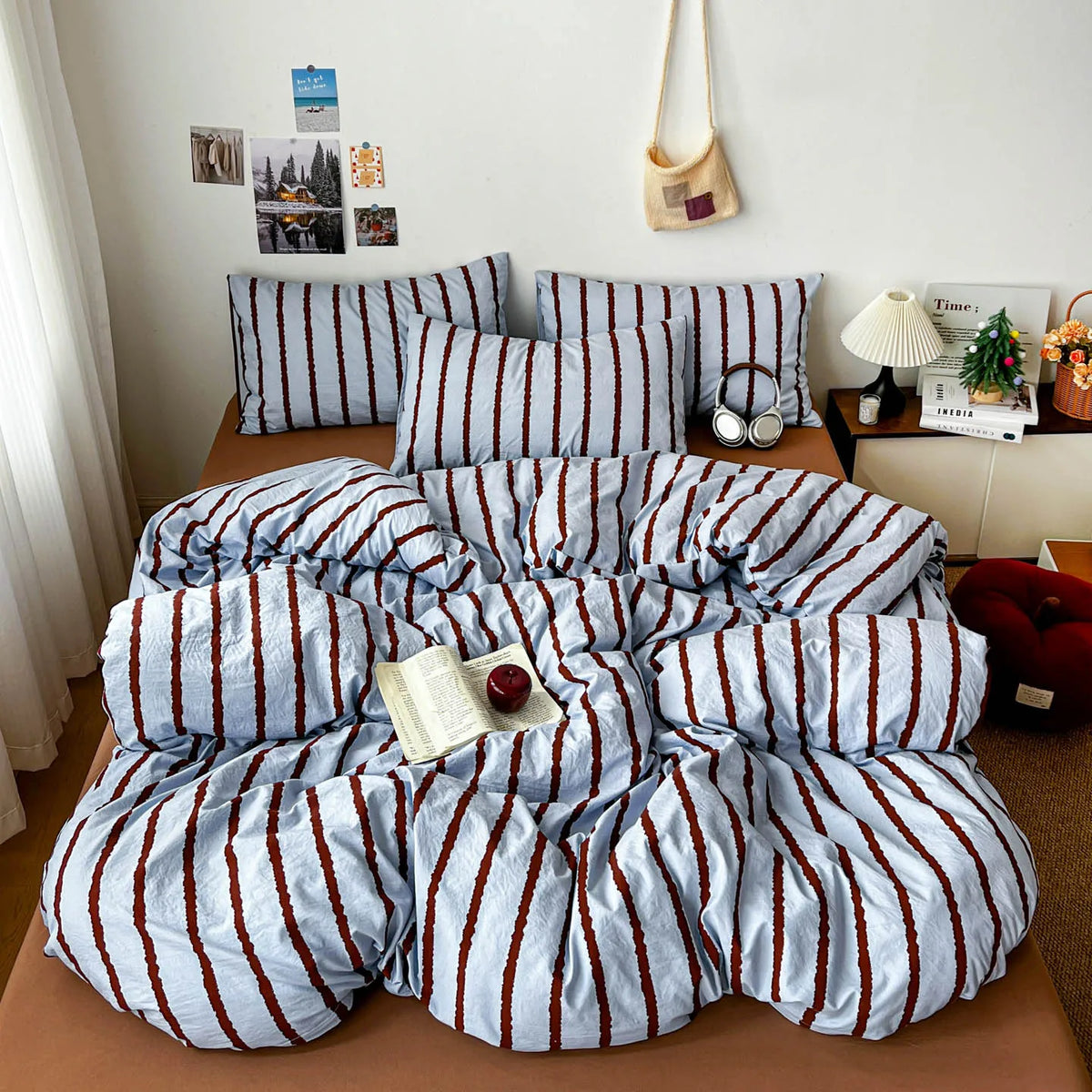 A set of soft washed cotton stripe duvet cover and pillowcases in blue and white stripes.