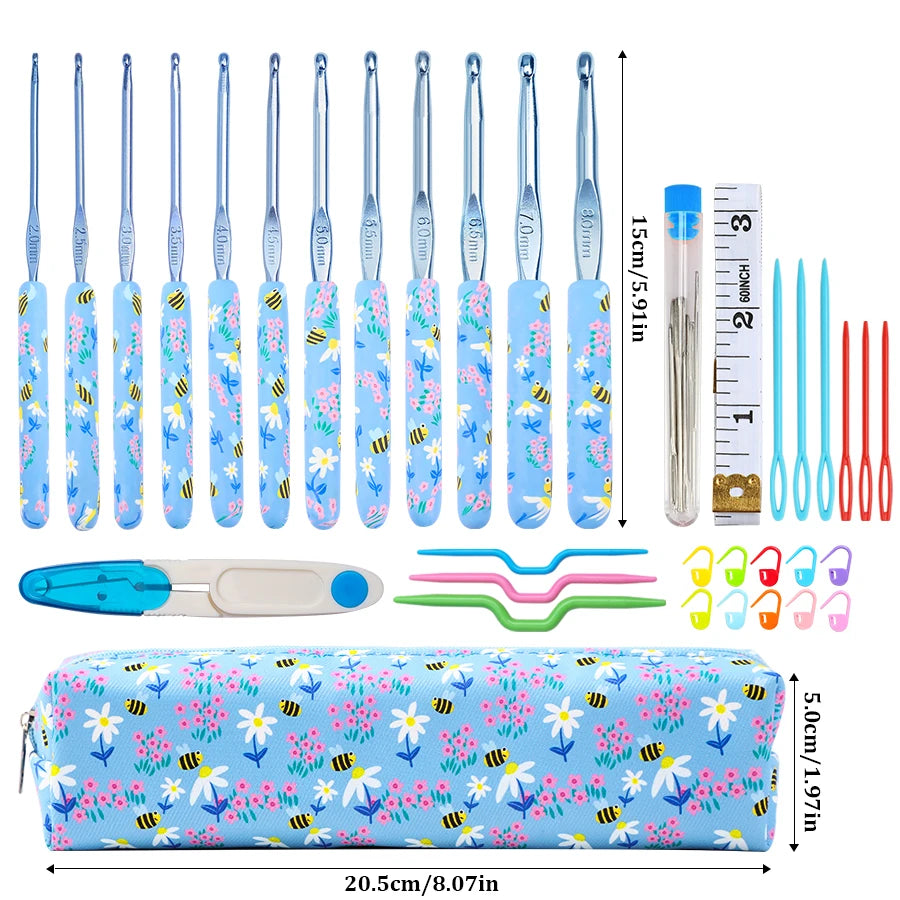 A set of ergonomic crochet hooks in various sizes and colors packaged in a blue floral patterned pouch.