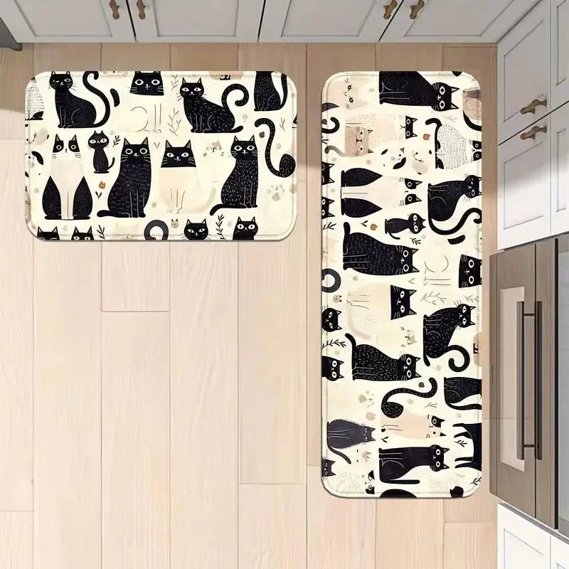 A set of black and white cat print non-slip kitchen mats with a soft flannel surface