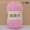 A skein of pink soft bulky chenille yarn is shown, packaged with a label indicating 6 pieces.