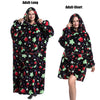 A woman models an adult-long black and green fruit print plush fleece blanket hoodie.