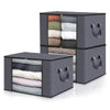 A stack of dark gray storage boxes filled with neatly folded clothing and blankets in various neutral colors.