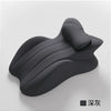 A dark gray memory foam wedge pillow with a contoured, wavy shape.