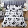A duvet cover set featuring a black and gray abstract geometric pattern on a white background.