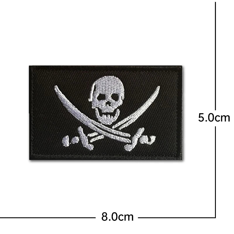 Black embroidery patch featuring a white pirate skull design for tactical gear