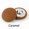 A round, brown fabric-covered shank button with a silver post is shown.
