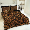A leopard print duvet cover set featuring brown and black animal print fabric displayed on a bed.