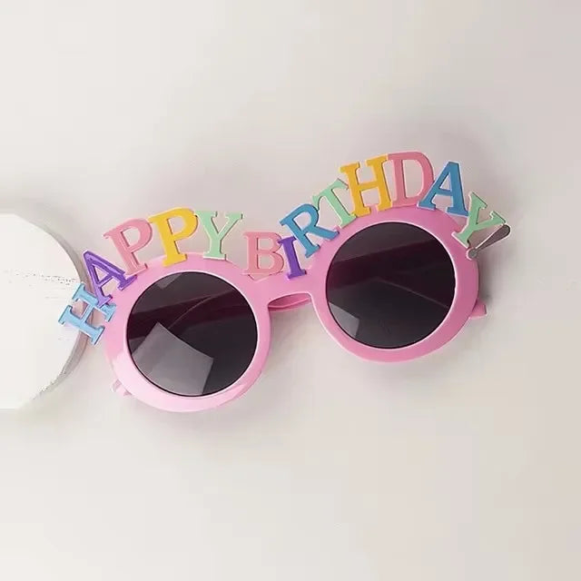 Pink birthday candle hat with happy birthday letters on the frame