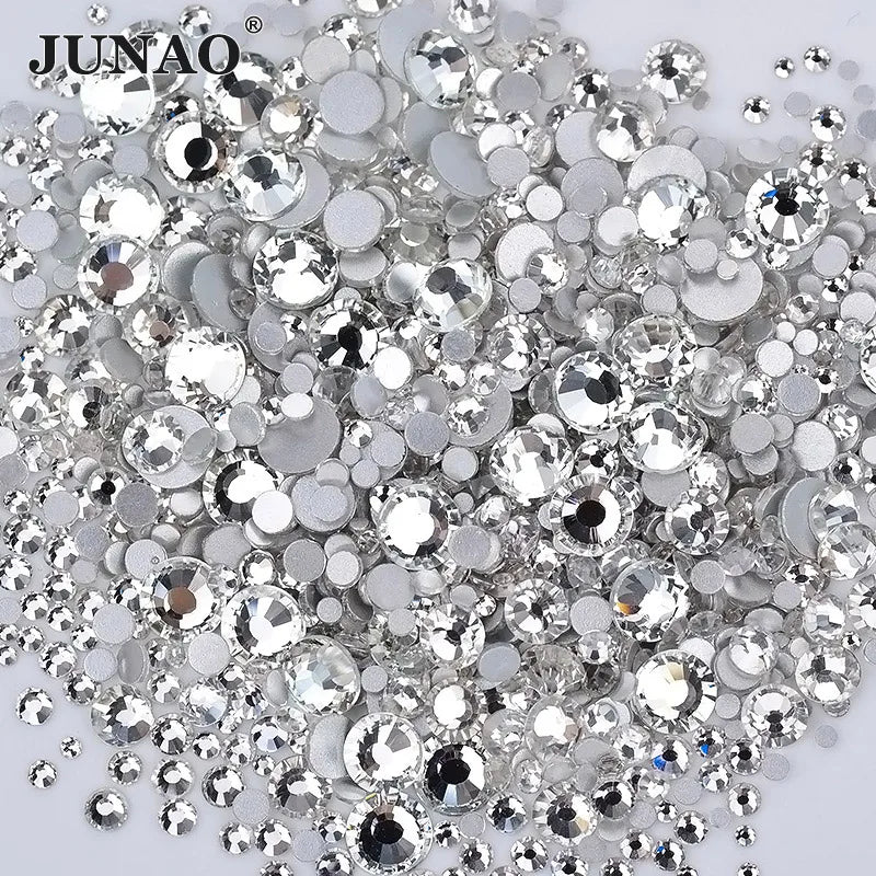 A pile of clear glass rhinestones and sequins for DIY crafts
