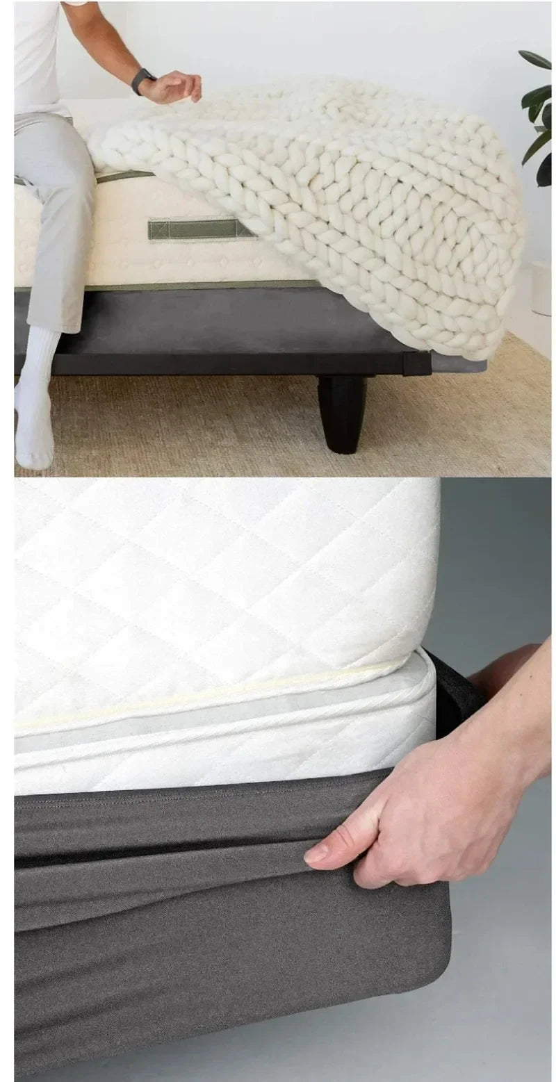 A hand is folding a gray box spring protector cover over a white pillow.