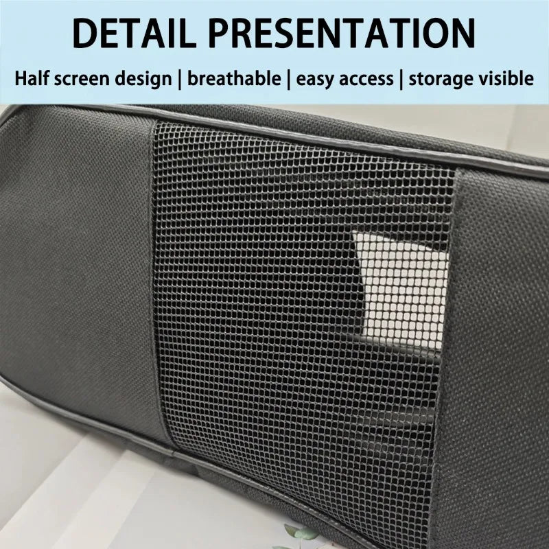 Close-up of a black portable shoe carrier bag featuring a breathable mesh panel.