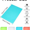 A set of reusable silicone fridge and drawer liners in green, clear, blue, and pink colors.
