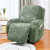 A textured moss green double-sided jacquard sofa cover set displayed on a wooden floor.