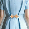 Light blue satin clothing clips adorned with sparkling rhinestones