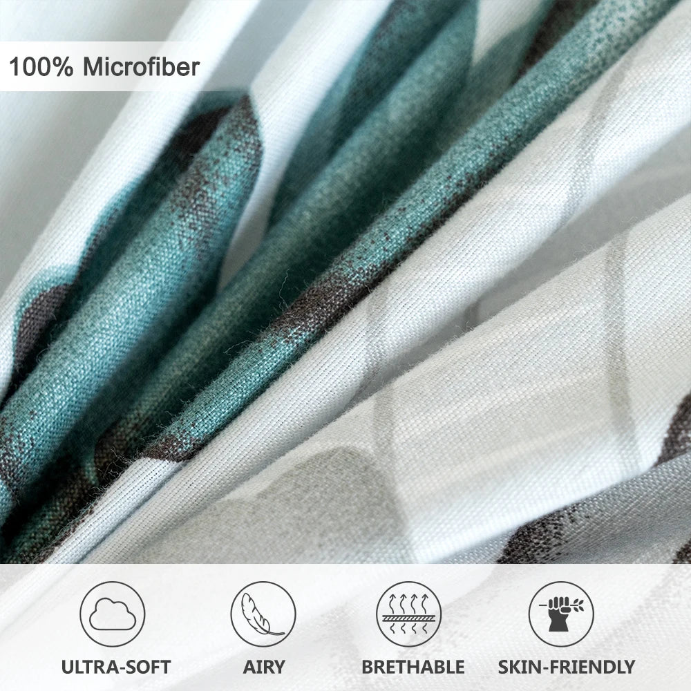 Close-up of a teal grey microfiber fabric showing watercolor floral patterns and texture.