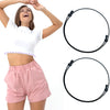 A woman models a pink crop top and shorts while demonstrating an adjustable crop tuck band for tops.