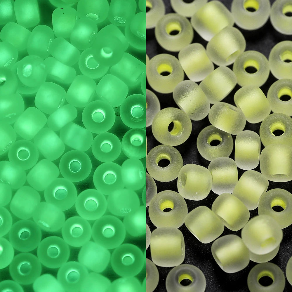 A close-up view of small, translucent green glow-in-the-dark glass seed beads.