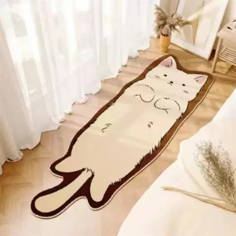 A beige cartoon cat plush rug lying on a light wooden floor next to a white curtain.