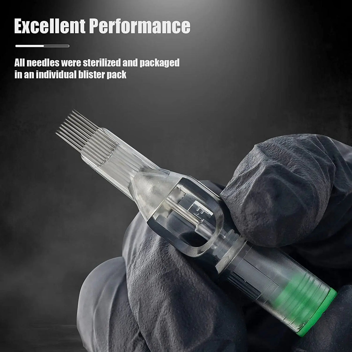 A gloved hand holds a single sterile needle cartridge for tattoo use.