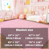 Pink plush long-pile area rug displayed in a brightly lit nursery room.