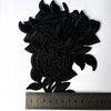 Black embroidered rose flower patches for DIY apparel displayed above a ruler.