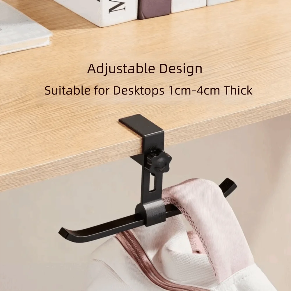 Black adjustable aluminum alloy desk hook with dual clips used to hang a bag or item.