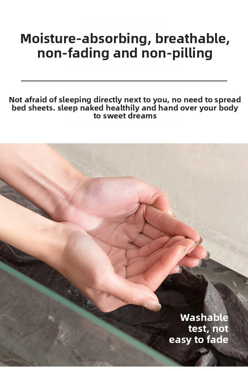 A hand is holding a dark fabric pillow cover, demonstrating its washable and non-fading qualities.