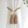 Hand-woven wooden curtain tiebacks with beige rope and natural fiber tassels