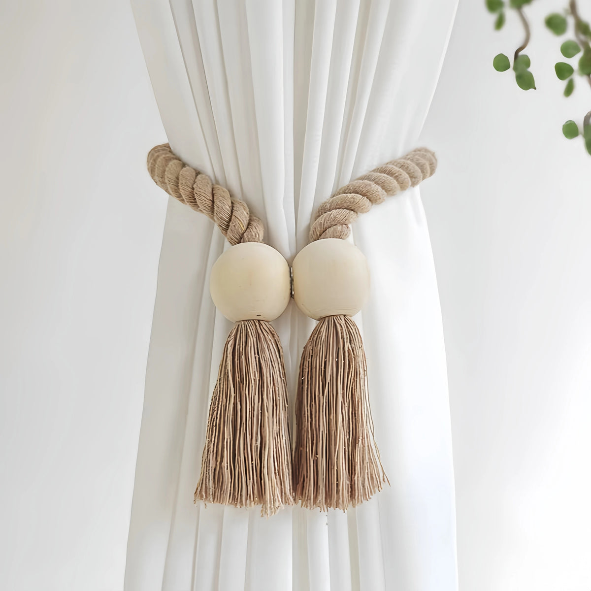 Hand-woven wooden curtain tiebacks with beige rope and natural fiber tassels