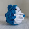 Handmade plush shark toy with blue and white coloring, labeled Emotional Support Shark.
