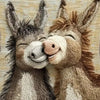 A knitted pillow cover featuring two adorable cartoon donkeys with expressive faces.