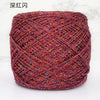 A ball of metallic silk crocheting and knitting yarn in a deep reddish-pink color.
