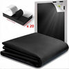 Black blackout curtains with adhesive strips shown in a rolled and unfolded form.