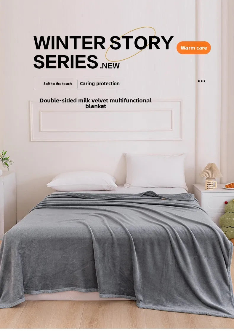 A gray velvet blanket is draped over a bed, set against a light wall with a framed sign promoting the Winter Story Series.